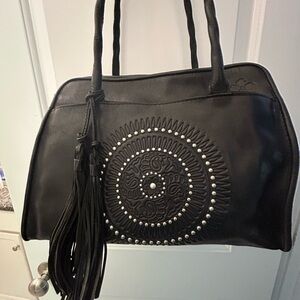 Patricia Nash bag w/ tassel and stud design.